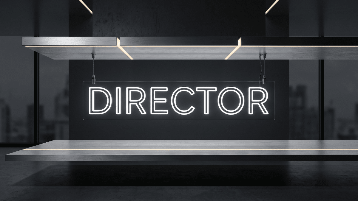 A neon sign reading DIRECTOR glowing above an empty corporate reception desk in a dark modern lobby, illustrating that the job title alone carries no salary information.